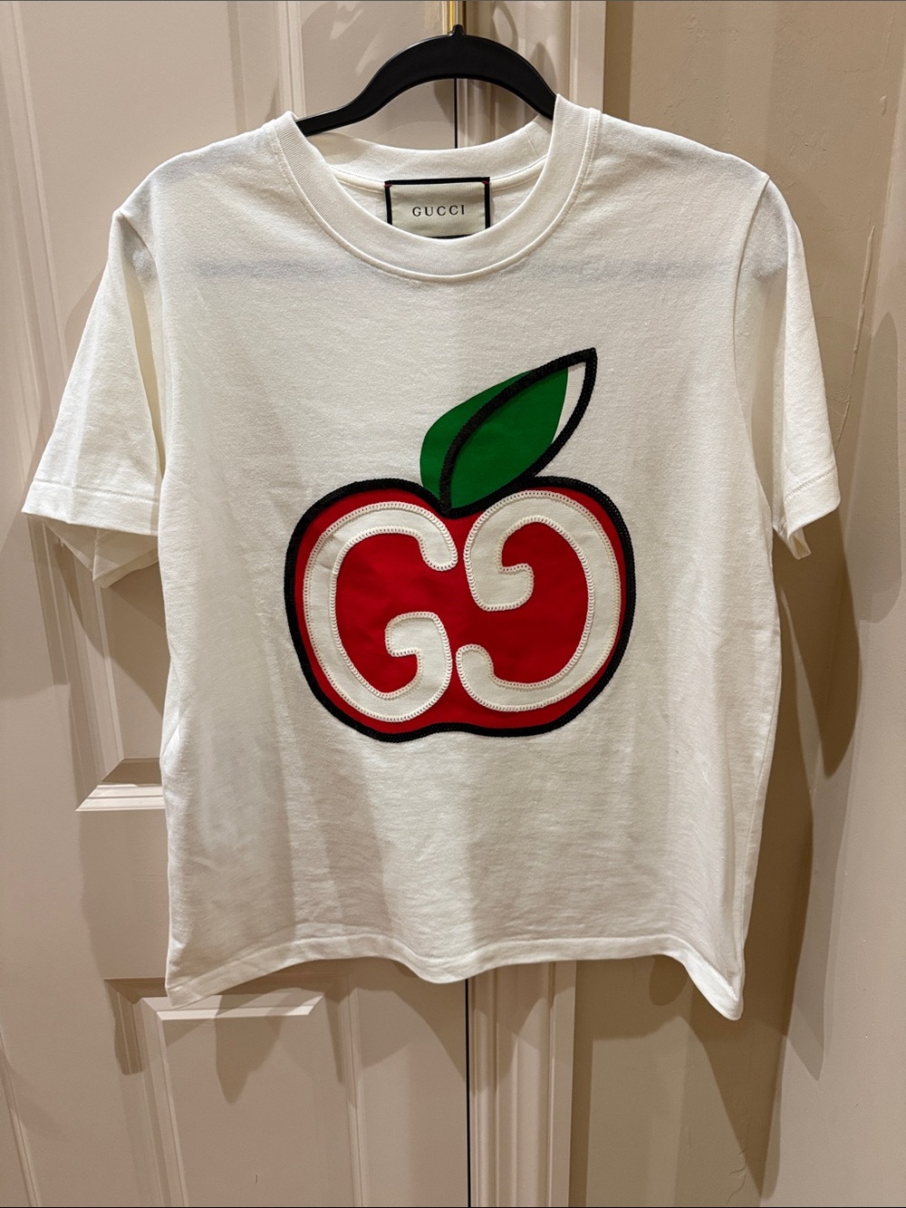 Gucci White Tee with Red Apple Logo and Green Leaf. Never worn.